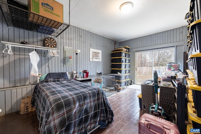 bedroom featuring wood finished floors and access to exterior