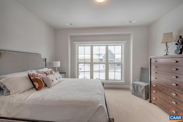 carpeted bedroom with visible vents