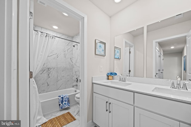 full bathroom featuring double vanity, toilet, shower / bath combo with shower curtain, and a sink