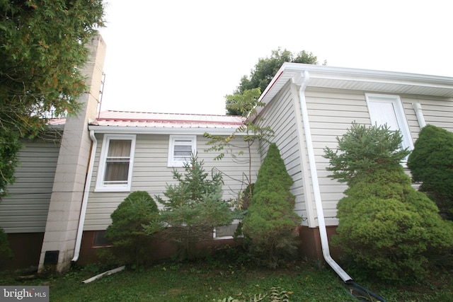 view of home's exterior featuring metal roof