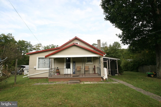 bungalow-style house with a porch and a front yard