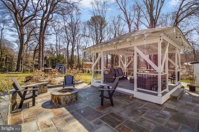 view of patio with a gazebo and an outdoor fire pit