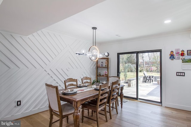 dining room featuring baseboards, an inviting chandelier, recessed lighting, ornamental molding, and light wood-type flooring