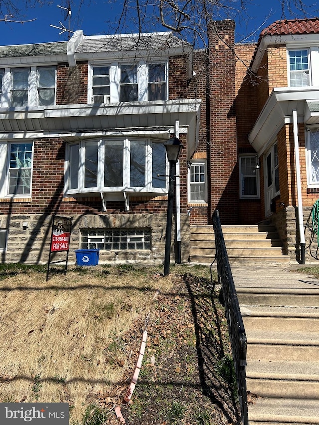 exterior space with brick siding