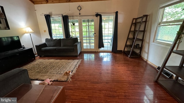 living room featuring baseboards and wood finished floors