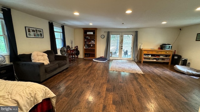 living area with french doors, wood finished floors, and recessed lighting