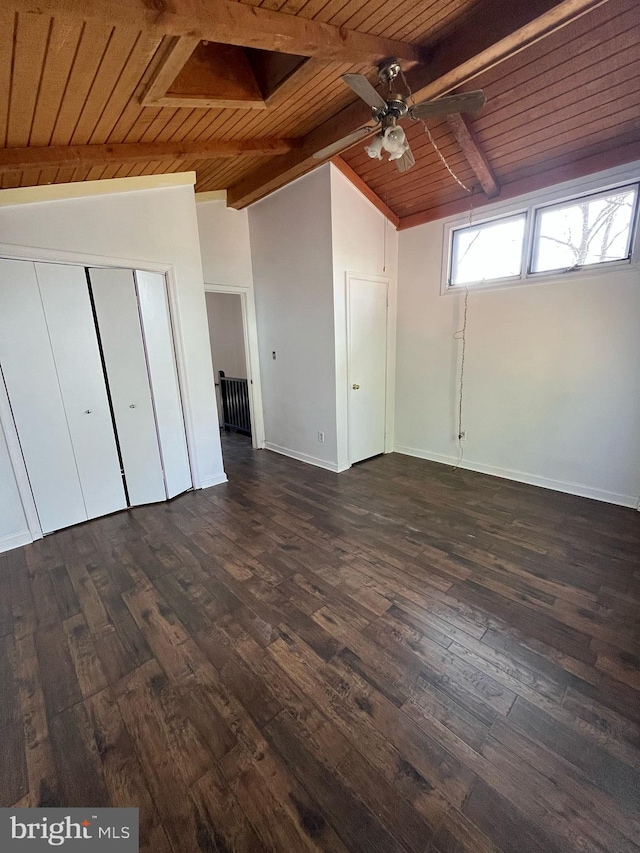 unfurnished bedroom featuring dark wood-style floors, wood ceiling, lofted ceiling with beams, and baseboards