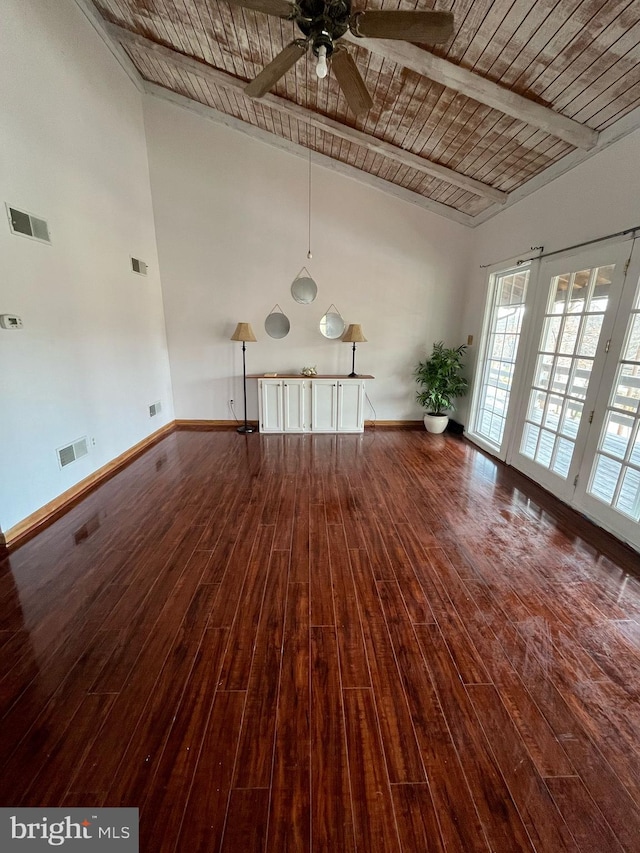 spare room featuring hardwood / wood-style flooring, baseboards, and visible vents