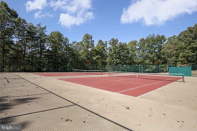 view of tennis court with fence