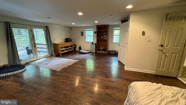 foyer entrance with recessed lighting, visible vents, baseboards, and wood finished floors