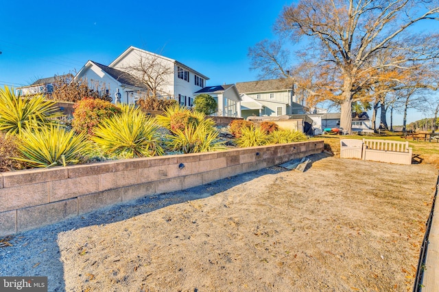 view of side of home with fence