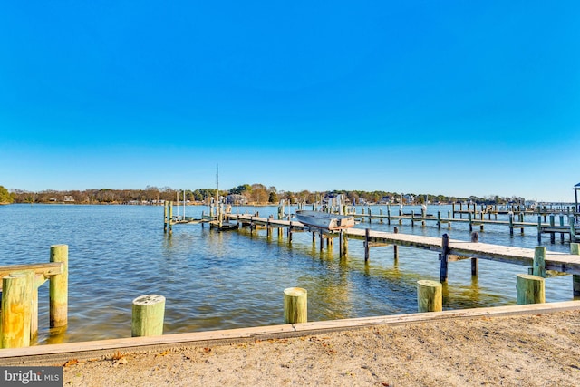 view of dock featuring a water view and boat lift