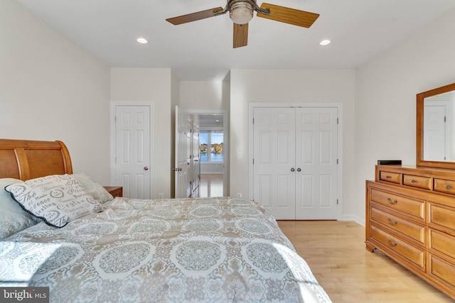 bedroom featuring recessed lighting, a closet, light wood-style floors, a ceiling fan, and baseboards