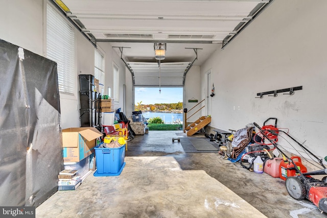 garage featuring a water view and a garage door opener