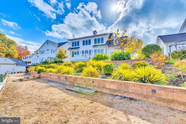 rear view of property with a residential view