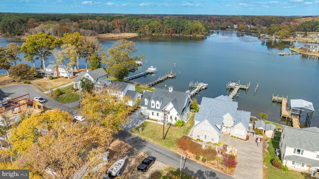 birds eye view of property with a water view, a forest view, and a residential view