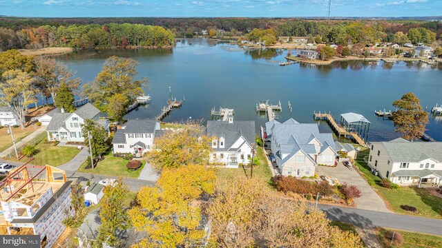 birds eye view of property featuring a residential view and a water view