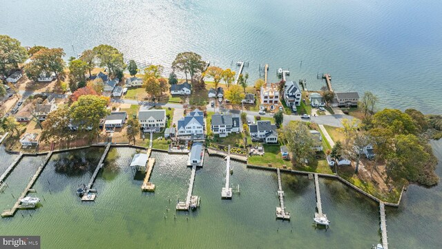 bird's eye view featuring a water view and a residential view