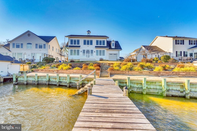 dock area featuring a water view and a residential view