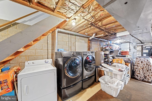 washroom featuring laundry area and separate washer and dryer