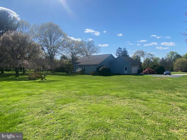 view of yard with an attached garage