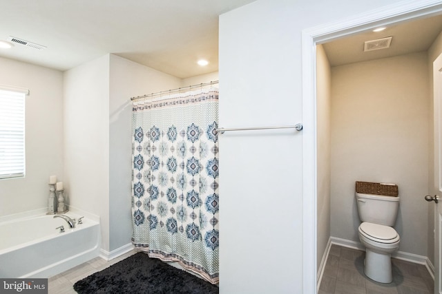 bathroom with toilet, curtained shower, tile patterned flooring, and visible vents