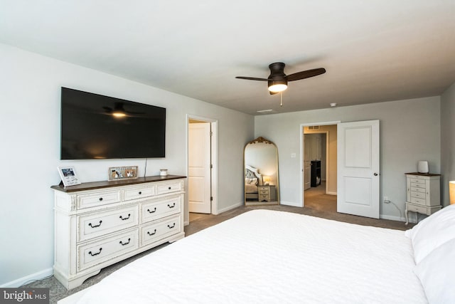 carpeted bedroom featuring ceiling fan and baseboards