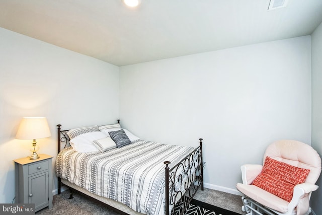 bedroom with carpet, visible vents, and baseboards