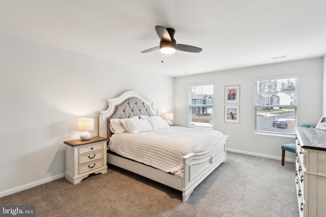 carpeted bedroom featuring a ceiling fan and baseboards