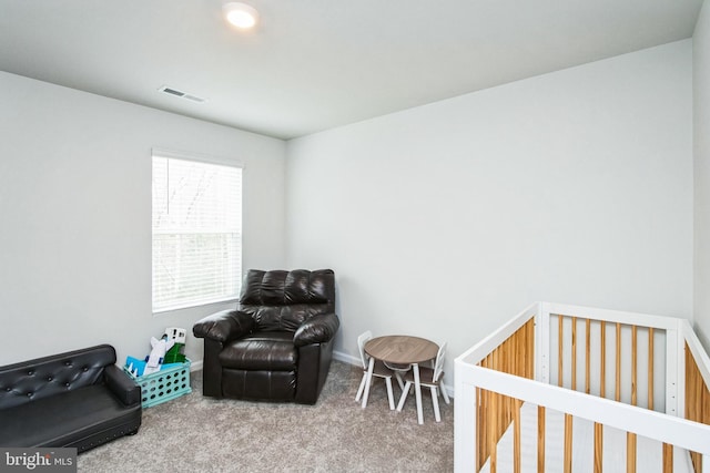 carpeted bedroom with visible vents and baseboards