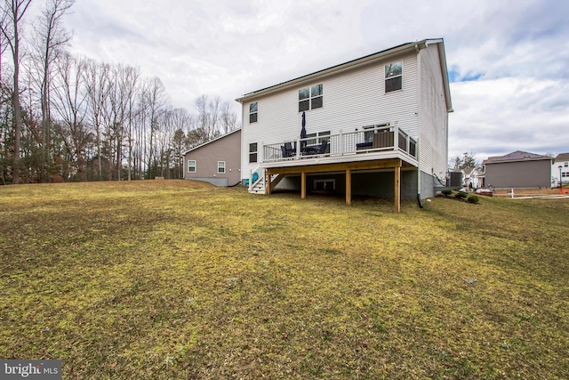 rear view of house with central air condition unit, a yard, a deck, and stairs