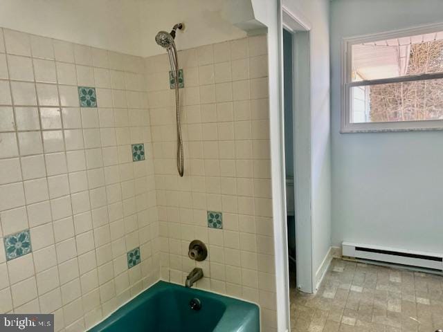 bathroom featuring shower / tub combination and baseboard heating