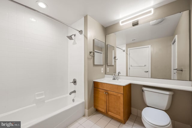 full bath with tile patterned flooring, toilet, vanity, baseboards, and washtub / shower combination