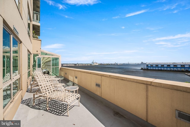 exterior space with a water view and visible vents