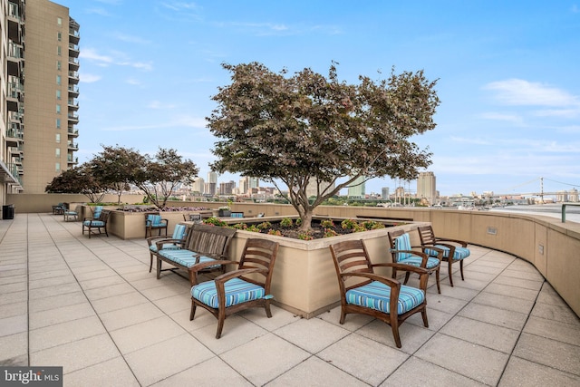 view of patio featuring outdoor lounge area and a city view