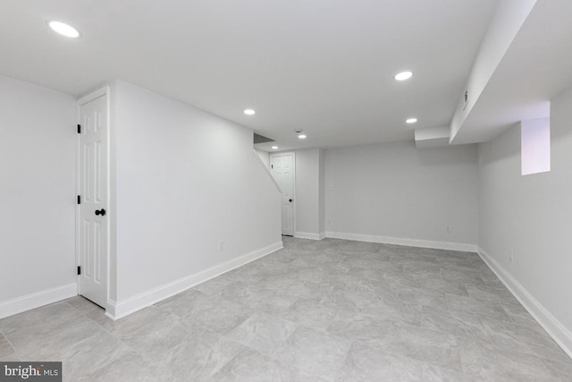 finished below grade area featuring recessed lighting and baseboards