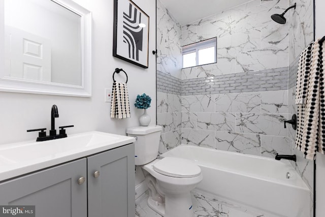 bathroom with toilet, marble finish floor, bathtub / shower combination, and vanity