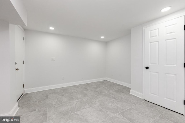 finished basement featuring recessed lighting and baseboards