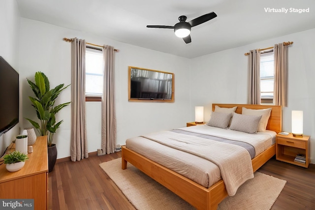 bedroom featuring dark wood-type flooring and ceiling fan