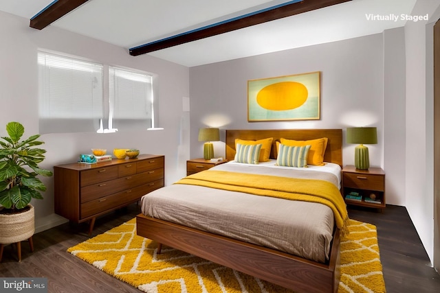 bedroom featuring beamed ceiling and dark wood-style flooring