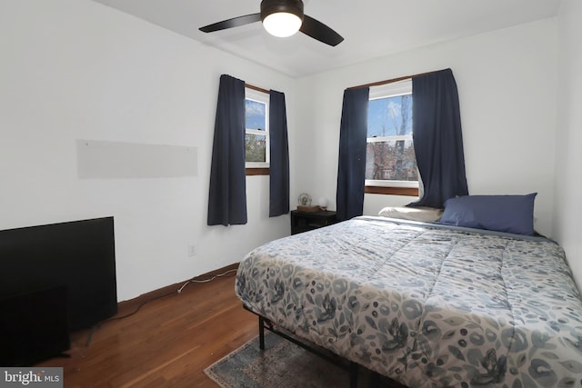 bedroom featuring a ceiling fan and wood finished floors