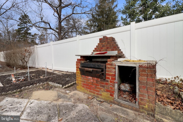 view of patio / terrace featuring fence