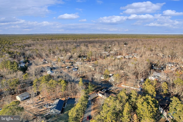 aerial view with a wooded view