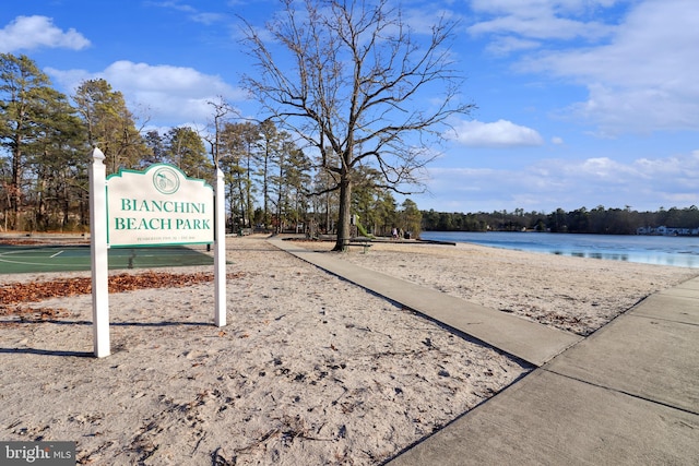 surrounding community featuring a water view