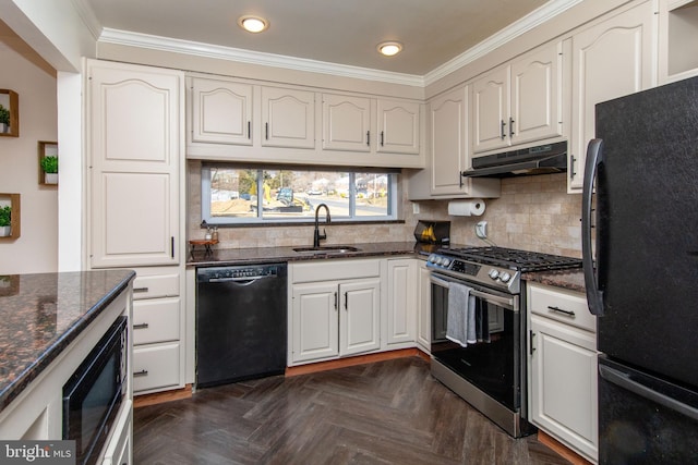 kitchen featuring dark stone countertops, a sink, black appliances, under cabinet range hood, and crown molding