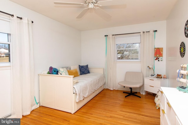 bedroom featuring light wood finished floors and a ceiling fan