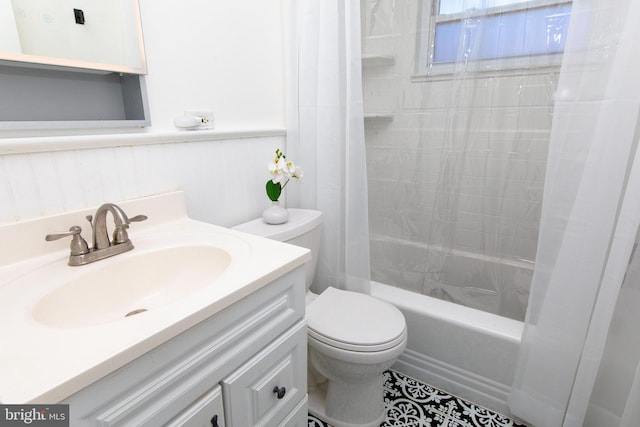 full bathroom featuring vanity, toilet, and shower / bath combo with shower curtain