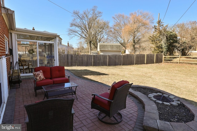 view of patio featuring an outdoor living space with a fire pit and a fenced backyard