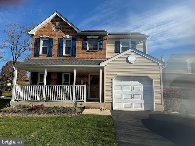 view of front of home with an attached garage, driveway, a porch, and brick siding