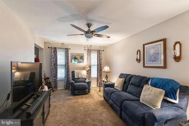 living room with carpet and a ceiling fan